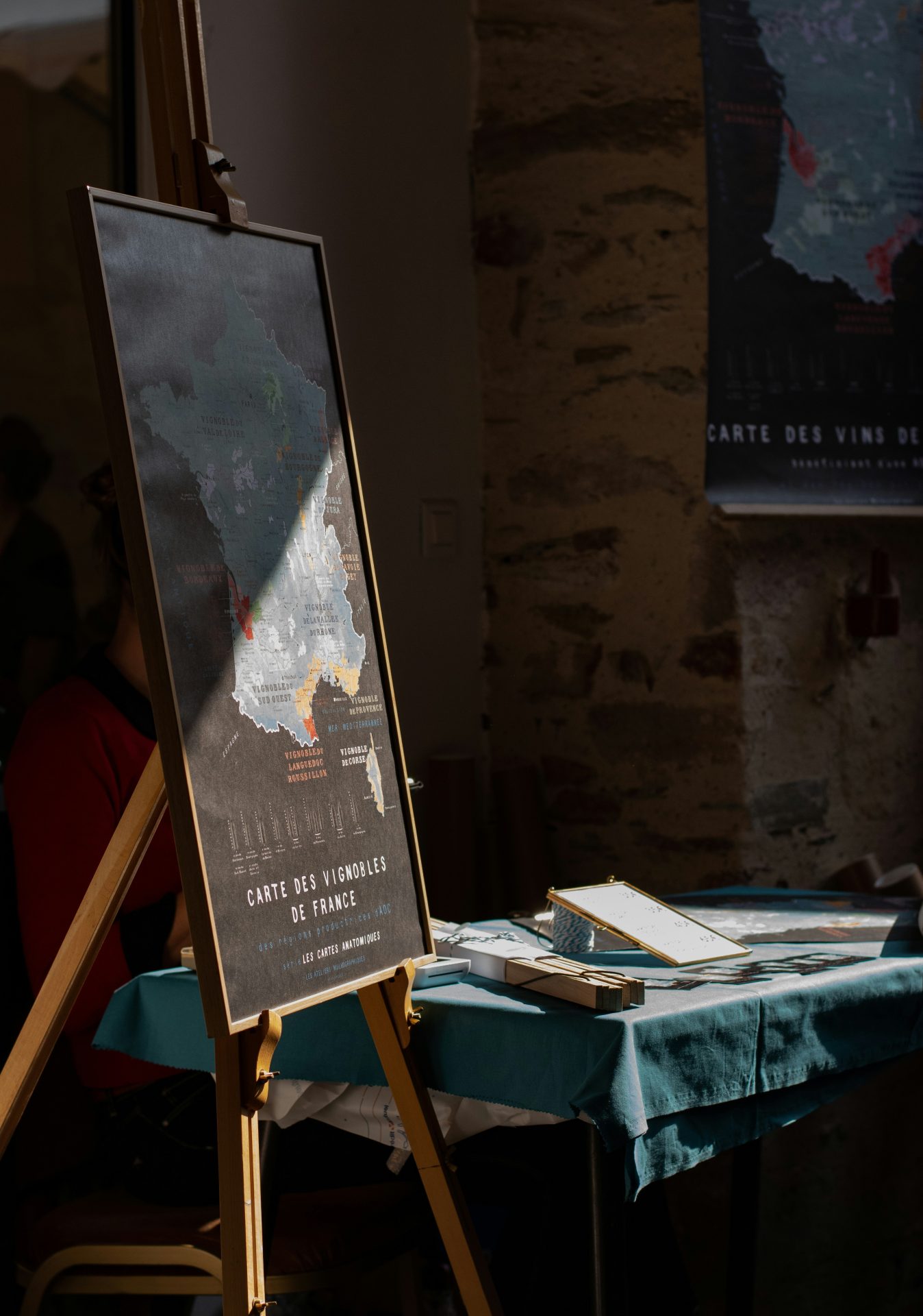 An easel displaying a poster inside a Catholic church