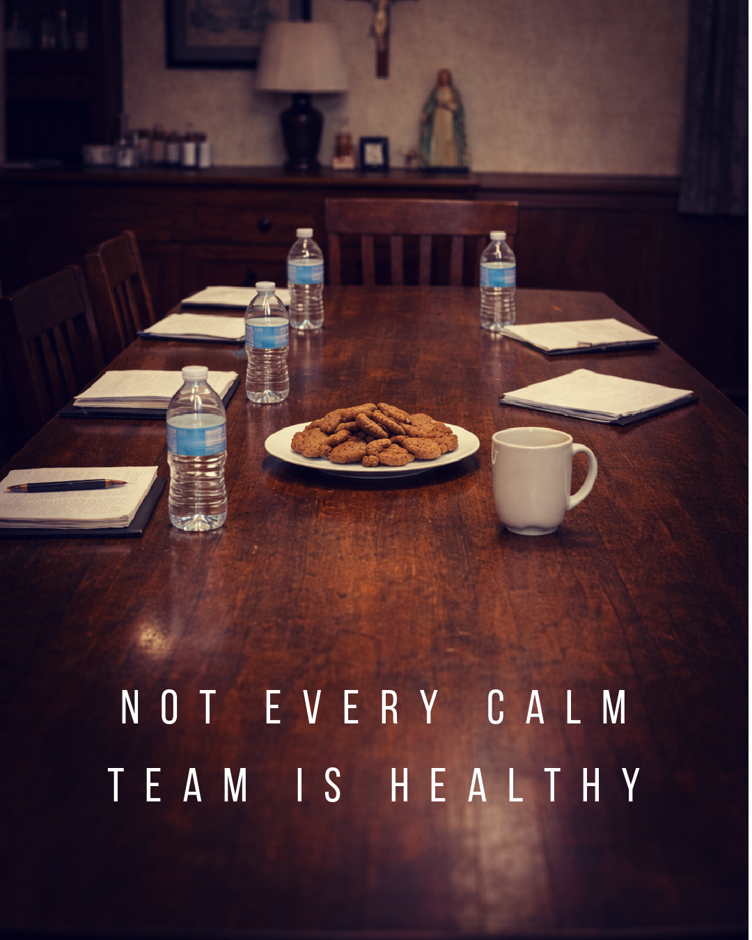 Empty parish meeting table prepared for a church leadership discussion.