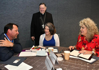 Bishop Kihneman Diocese of Biloxi at event with Burning Hearts